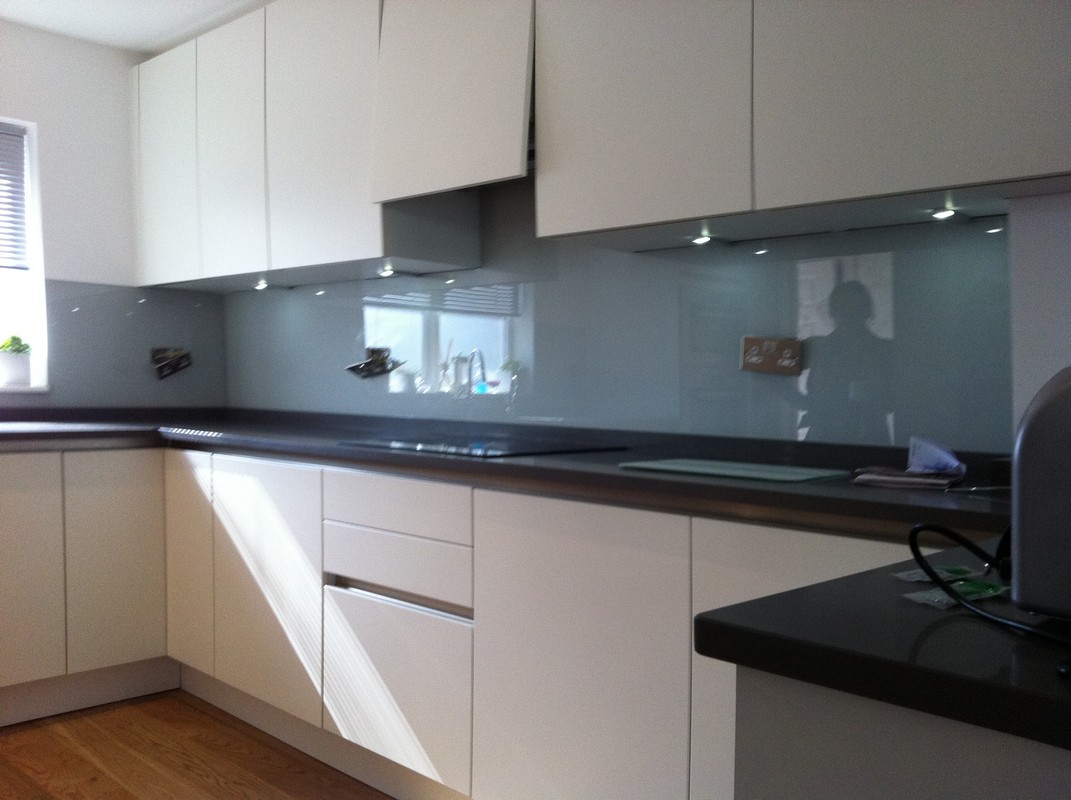 Grey glass kitchen splashback with LED lighting in Seven Sisters