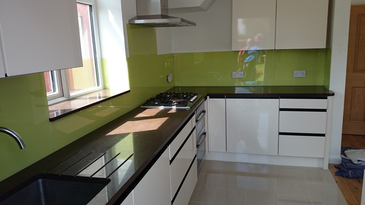 Lime green glass kitchen splashback installed by Seven Sisters glaziers