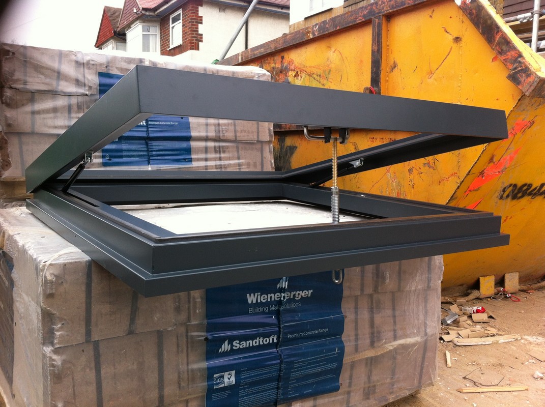 Opening flat roof skylight in anthracite grey installed in Seven Sisters